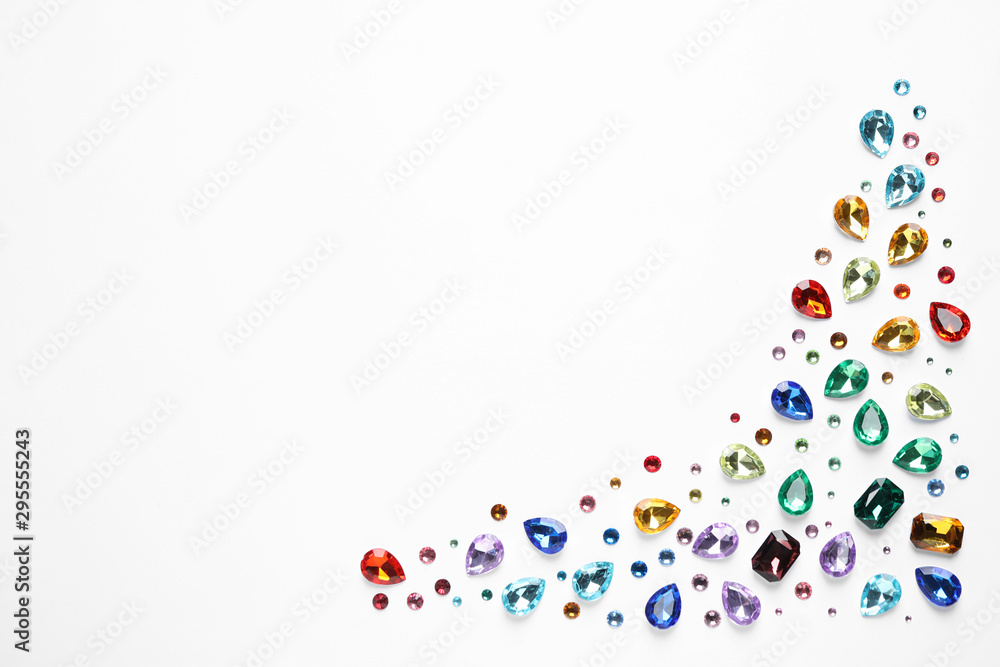 Different beautiful gemstones on white background, top view Different beautiful gemstones on white background, top view