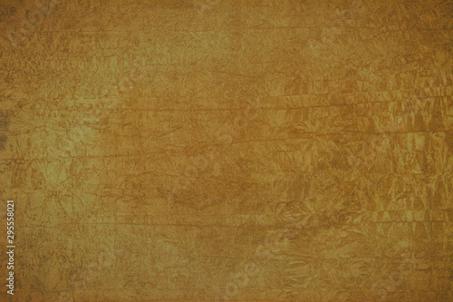 Background of ocher color on rough surface