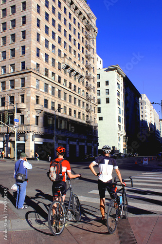 Los Angeles, California, USA. October 3, 2019. Pershing Square. Cyclists at a pedestrian crossing in Downtown Los Angeles.