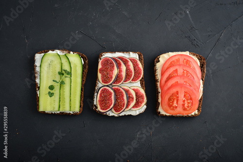 Vegetarian sandwich with cucumber, tomato, figs and avocado