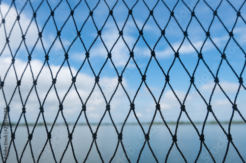 Net on sky and sea background