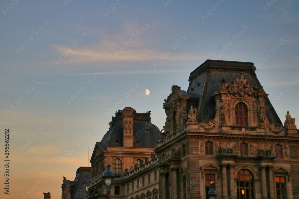 cathedral in sunset with the moon in the background