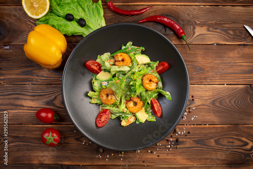 Tiger shrimp and avocado salad with spinach, iceberg and tobiko caviar with light creamy sauce