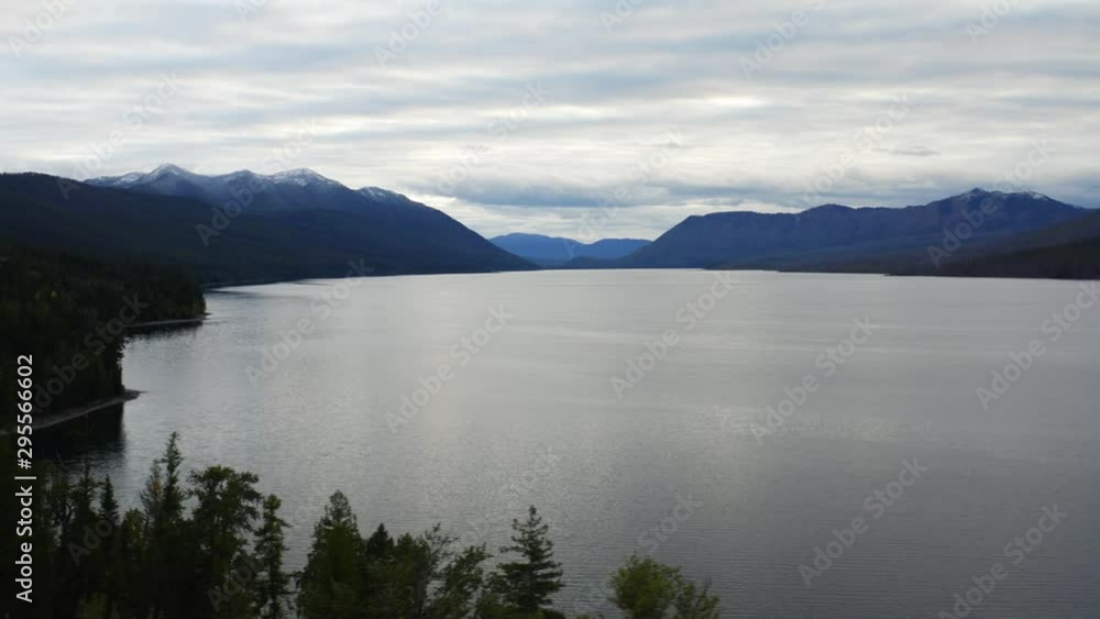 Lake McDonald in Glacier National Park, travel around the United States, beautiful Montana, snowy mountains' tops, breathtaking landscape Lake McDonald in Glacier National Park, travel around the United States, beautiful Montana, snowy mountains' tops, breathtaking landscape