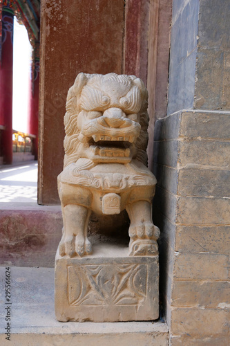 Stone rock lion statue in Tulou Temple of Beishan Mountain, Yongxing Temple in Xining Qinghai China. photo