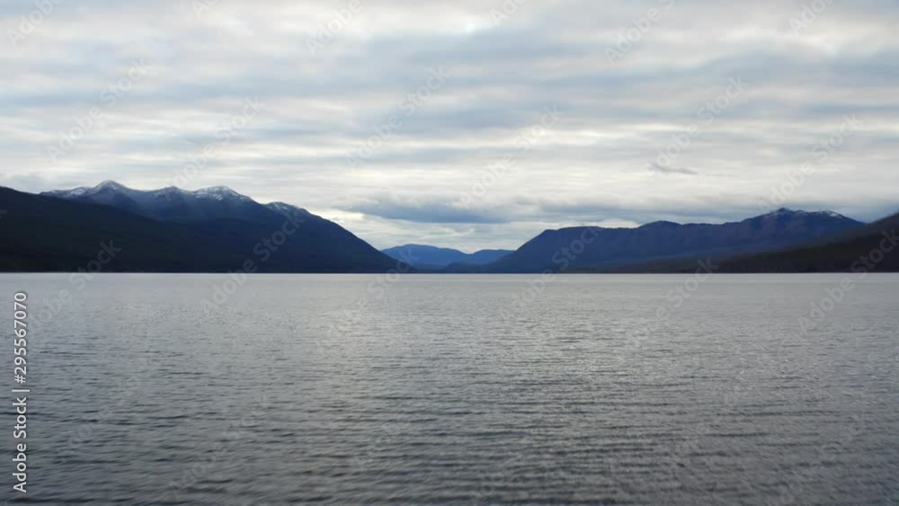 Lake McDonald in Glacier National Park, travel around the United States, beautiful Montana, snowy mountains' tops, breathtaking landscape Lake McDonald in Glacier National Park, travel around the United States, beautiful Montana, snowy mountains' tops, breathtaking landscape
