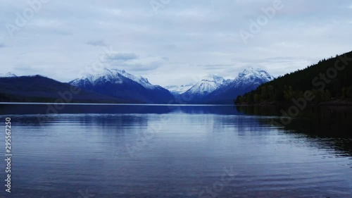Lake McDonald in Glacier National Park, travel around the United States, beautiful Montana, snowy mountains' tops, breathtaking landscape photo