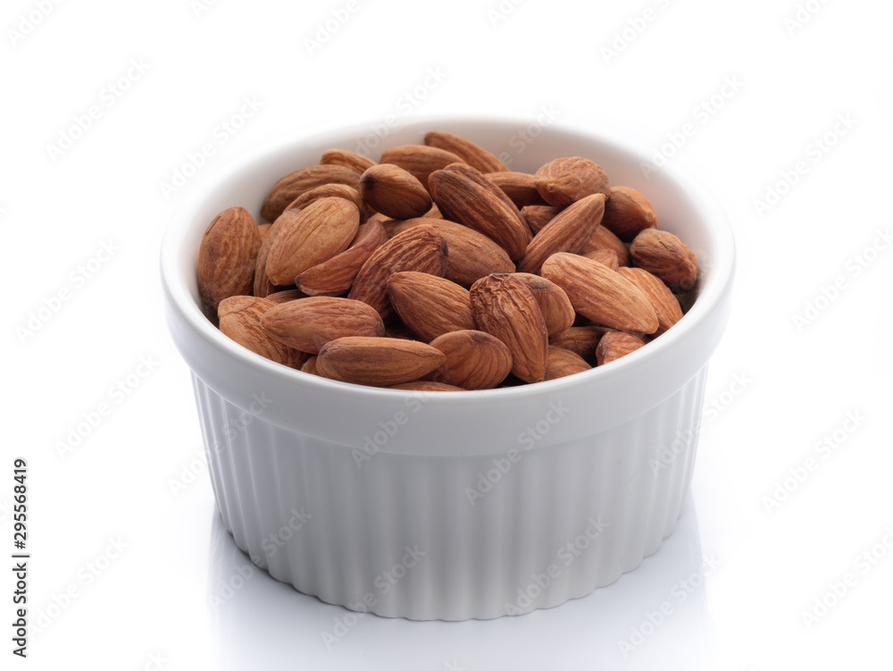 Top view of almond nut in white ceramic bowl, isotated on white background Top view of almond nut in white ceramic bowl, isotated on white background