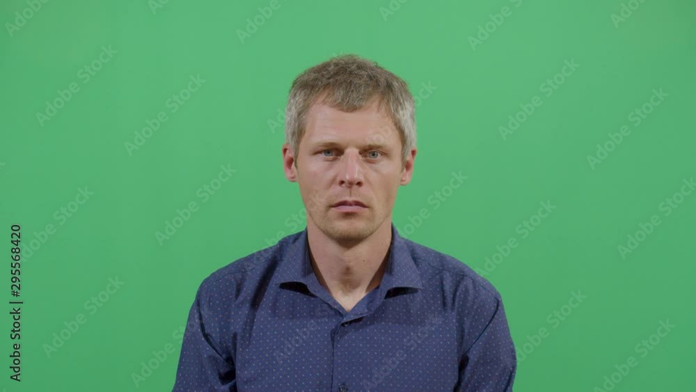 Adult Man Opening And Closing The Mouth Looking At The Camera. Studio Isolated Shot Against Green Screen Background Adult Man Opening And Closing The Mouth Looking At The Camera. Studio Isolated Shot Against Green Screen Background