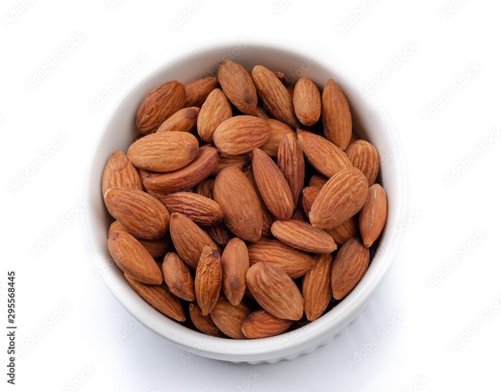 Top view of almond nut in white ceramic bowl, isotated on white background Top view of almond nut in white ceramic bowl, isotated on white background