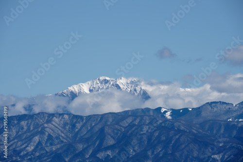 Snowy mountains with cloud and sky © makoto sato