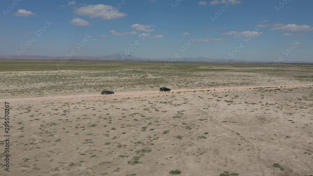 Plains and Road Chasing Black Luxury Cars Plains and Road Chasing Black Luxury Cars