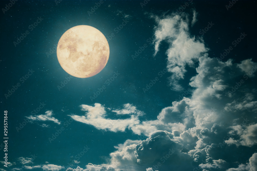 Romantic night scene - Beautiful full moon with cloud in night skies.  Retro style with vintage color tone.