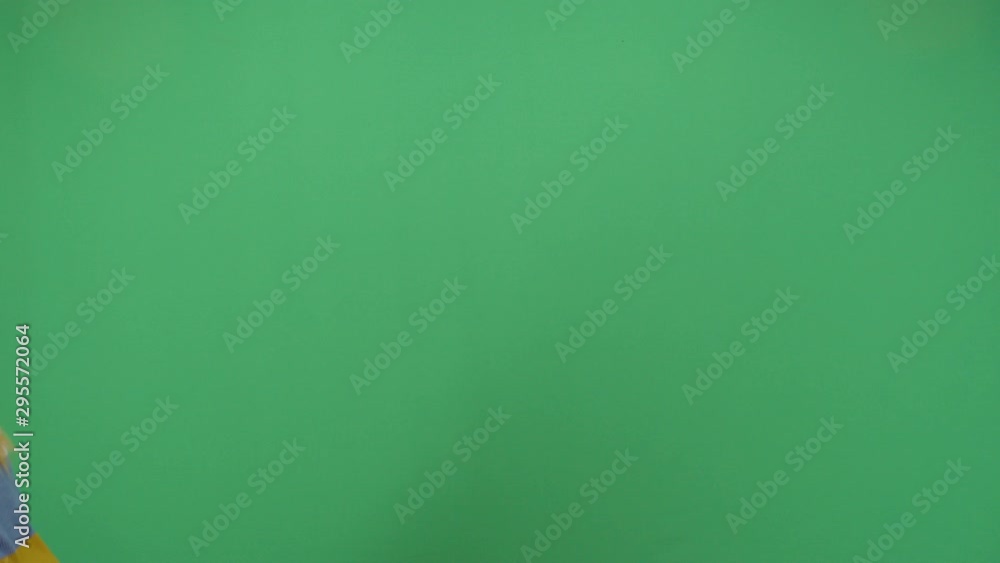 Woman Walking From Right To Let Side Of The Scene Like Descending Stairs. Studio Isolated Shot Against Green Screen Background Woman Walking From Right To Let Side Of The Scene Like Descending Stairs. Studio Isolated Shot Against Green Screen Background