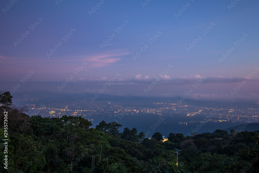 Blue and pink rainy night sky over San Salvador and Santa Tecla, El Salvador, Central America. September 2019