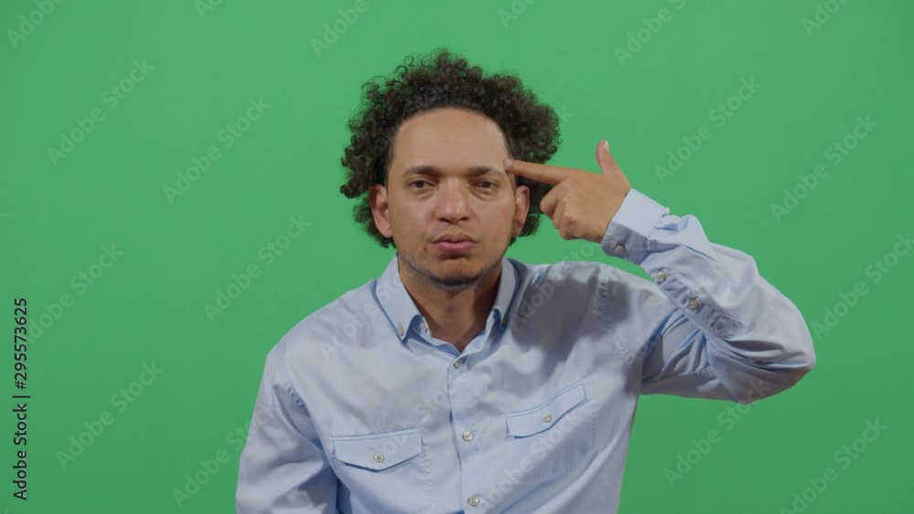 Adult Man Blowing His Brains Out With Hand Like Gun. Studio Isolated Shot Against Green Screen Background Adult Man Blowing His Brains Out With Hand Like Gun. Studio Isolated Shot Against Green Screen Background