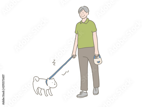 散歩を嫌がる犬と中年男性