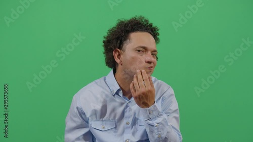 Adult Man Pimple Popping Looking At The Camera. Studio Isolated Shot Against Green Screen Background