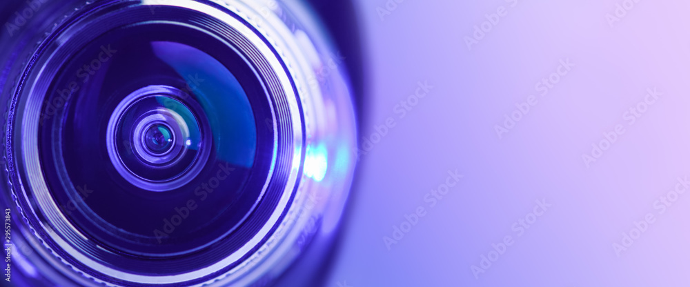 Banner. Close-up camera lens with purple backlight. Optics. - obrazy, fototapety, plakaty 