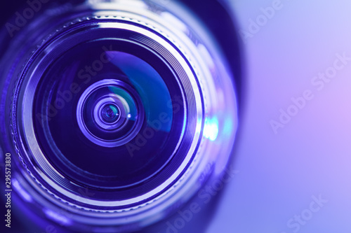 Close-up camera lens with purple backlight. Optics. Gorizontal photo