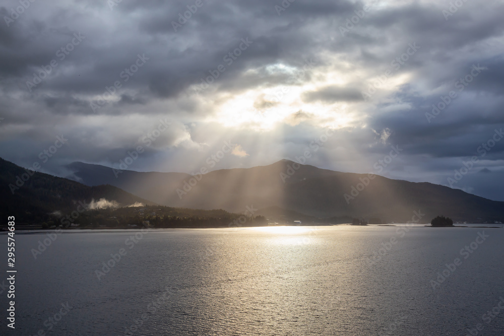 Beautiful View of Sunrays over the Ocean Coast during a stormy morning. Taken near Ketchikan, Alaska, United States.