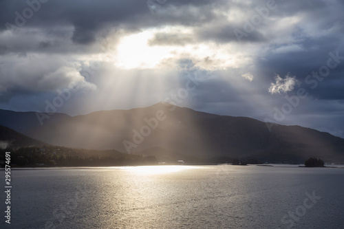Beautiful View of Sunrays over the Ocean Coast during a stormy morning. Taken near Ketchikan, Alaska, United States.