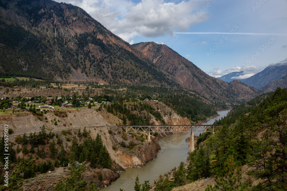 Beautiful View of a small Town, Lillooet, during a sunny and cloudy summer day. Located in the Interior British Columbia, Canada.
