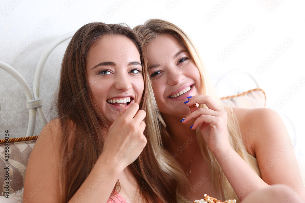 Portrait of two beautiful young smiling female Portrait of two beautiful young smiling female