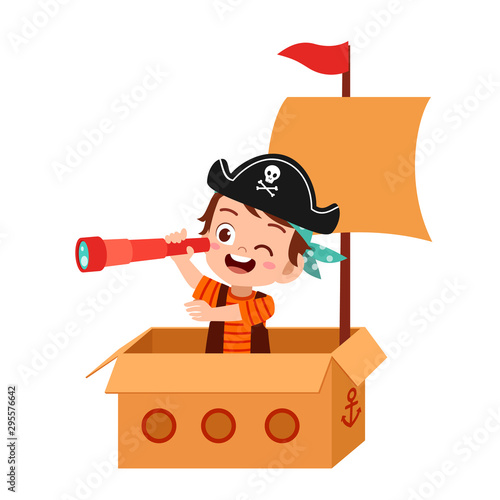 happy kid boy play toy ship cardboard