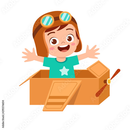 happy kid boy play toy plane cardboard