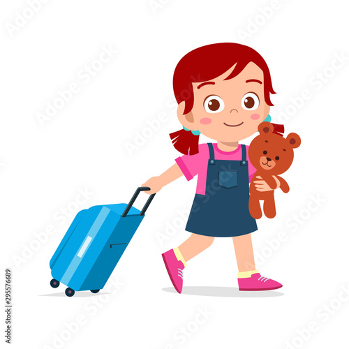 happy cute kid girl pull bag with teddy