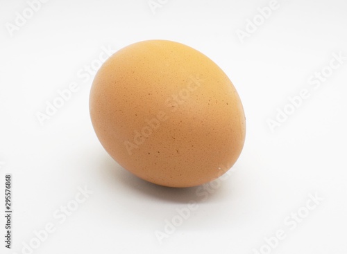 Brown egg isolated on white background.