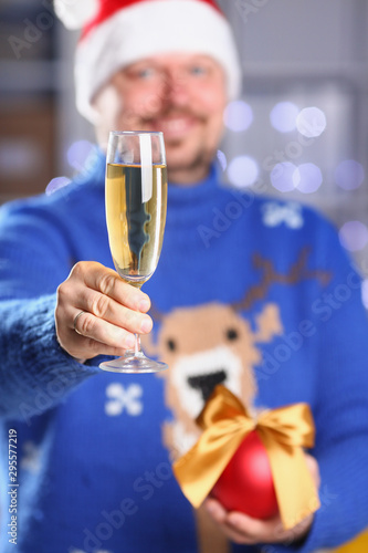 Bearded smiling man wearing warm blue sweater