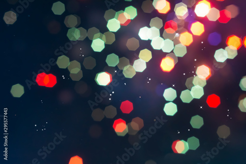 Defocused of beautiful  polygon lights..Bokeh of colorful lighting in 7 polygon heptagon in smoky night background. photo