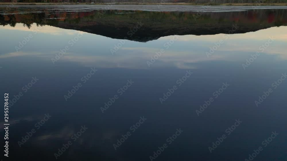 Aerial 4K drone shot of Mount Monadnock over pond with reflection on water surface Aerial 4K drone shot of Mount Monadnock over pond with reflection on water surface