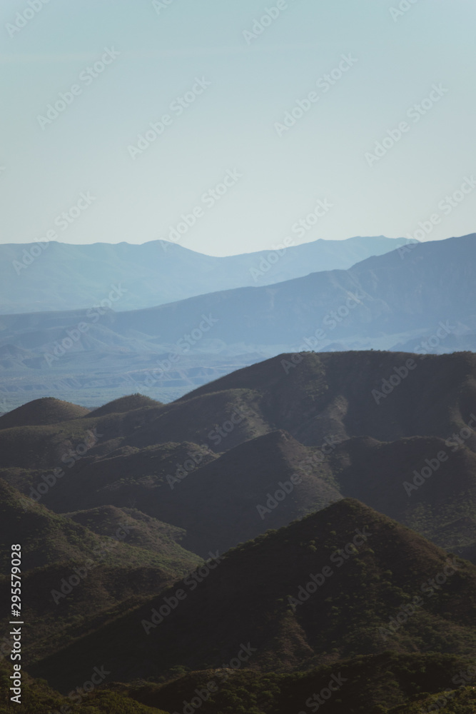 Obraz premium Colorful mountains far away with a clean and blue sky