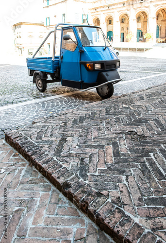 Typical italian farm ape truck on three wheels. photo