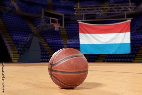 Luxembourg flag and basketball on Court Floor © Derek Brumby
