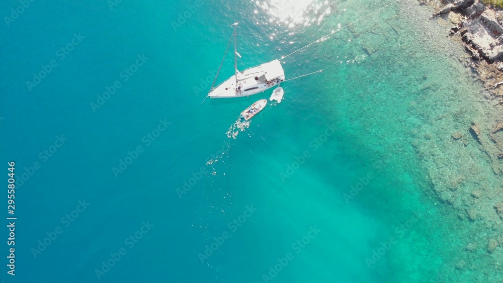 Sailing yacht moored to the shore, a delightful seascape drone photo.