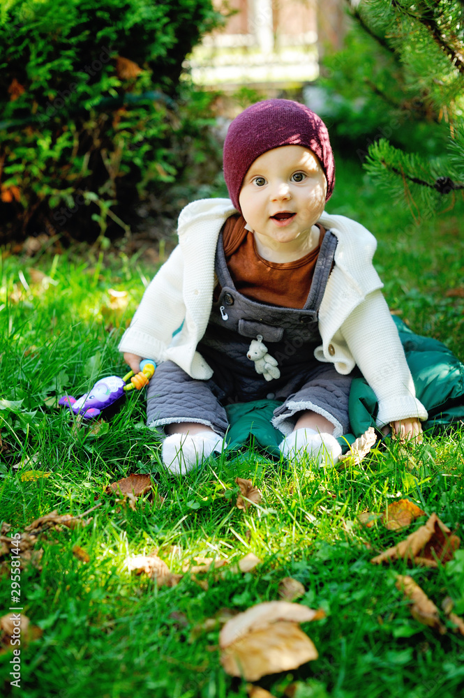 Cute newborn baby in warm wool knitted hat and sweater Cute newborn baby in warm wool knitted hat and sweater