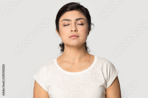 Calm indian girl meditate breathing fresh air