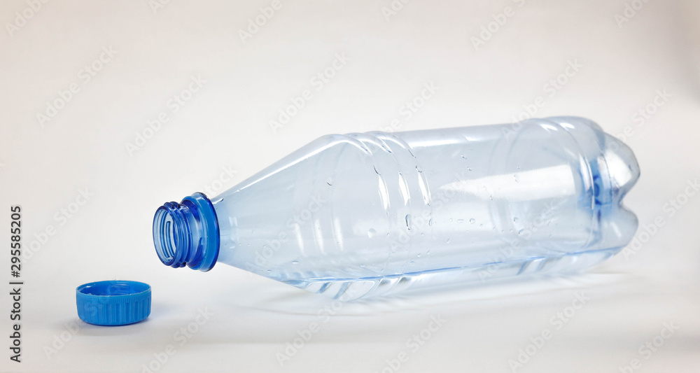 Blue bottle with drinking water. Close up. Isolated on white background Blue bottle with drinking water. Close up. Isolated on white background
