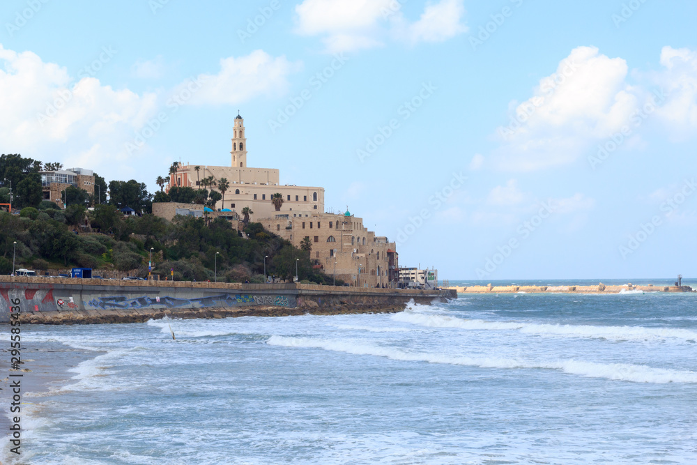 Coastline panorama of city Tel Aviv Jaffa with mediterranean sea and St. Peters Church in Israel