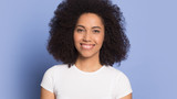 Portrait of smiling biracial young woman look at camera