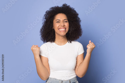 Overjoyed african American girl feel euphoric with win
