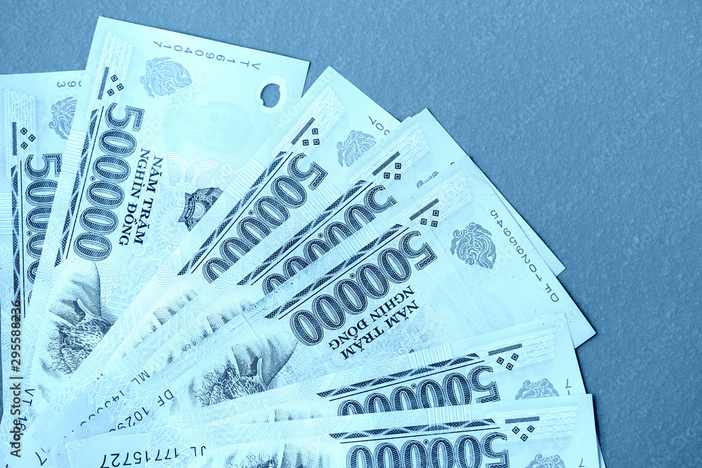 Five hundred thousand vietnamese dongs close up. Money background blue color toned Five hundred thousand vietnamese dongs close up. Money background blue color toned