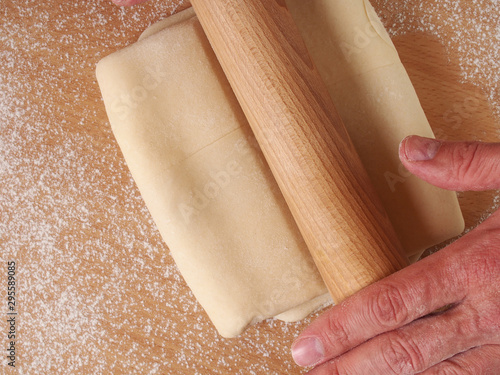 Foto Rolling dough. Making Puff Pastry Series.