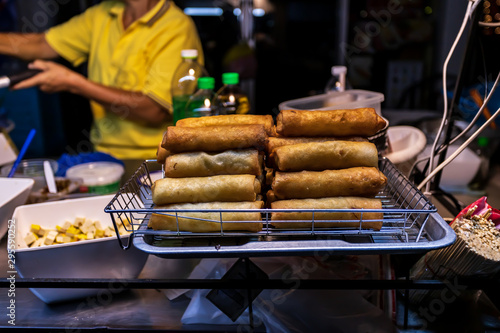 Hand made spring rolls on a food cart in Bangkok