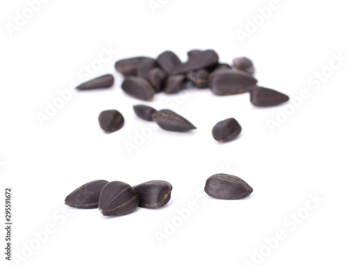 Obraz na plátně Sunflower black seeds isolated on white background