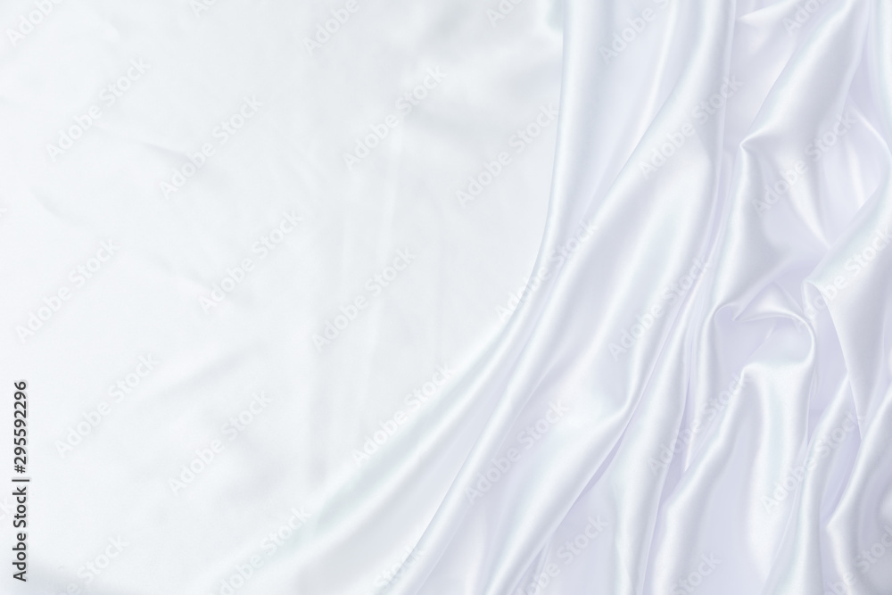 Crumpled of white satin for abstract and design, Detail and grooved of fabric for background and textured